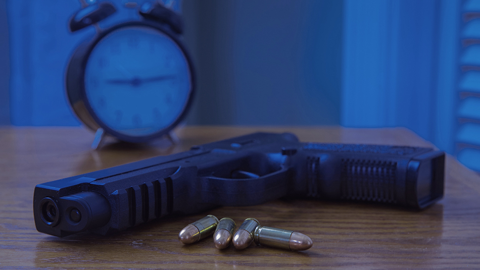 gun on nightstand 950 1
